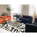 Tavolino da salotto accentato con piano in pietra nera e oro – Design scultoreo moderno